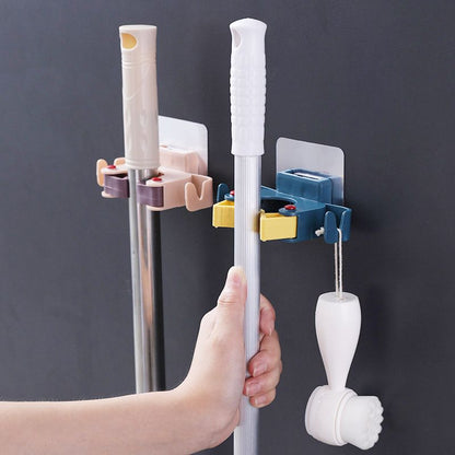 🥳HOT SALE🥳💞50K+ SOLD! Mop Clip Holder – From £6.98! Nail-free adhesive, holds 3kg & 2 hooks. Tidy space instantly – grab yours! ✅